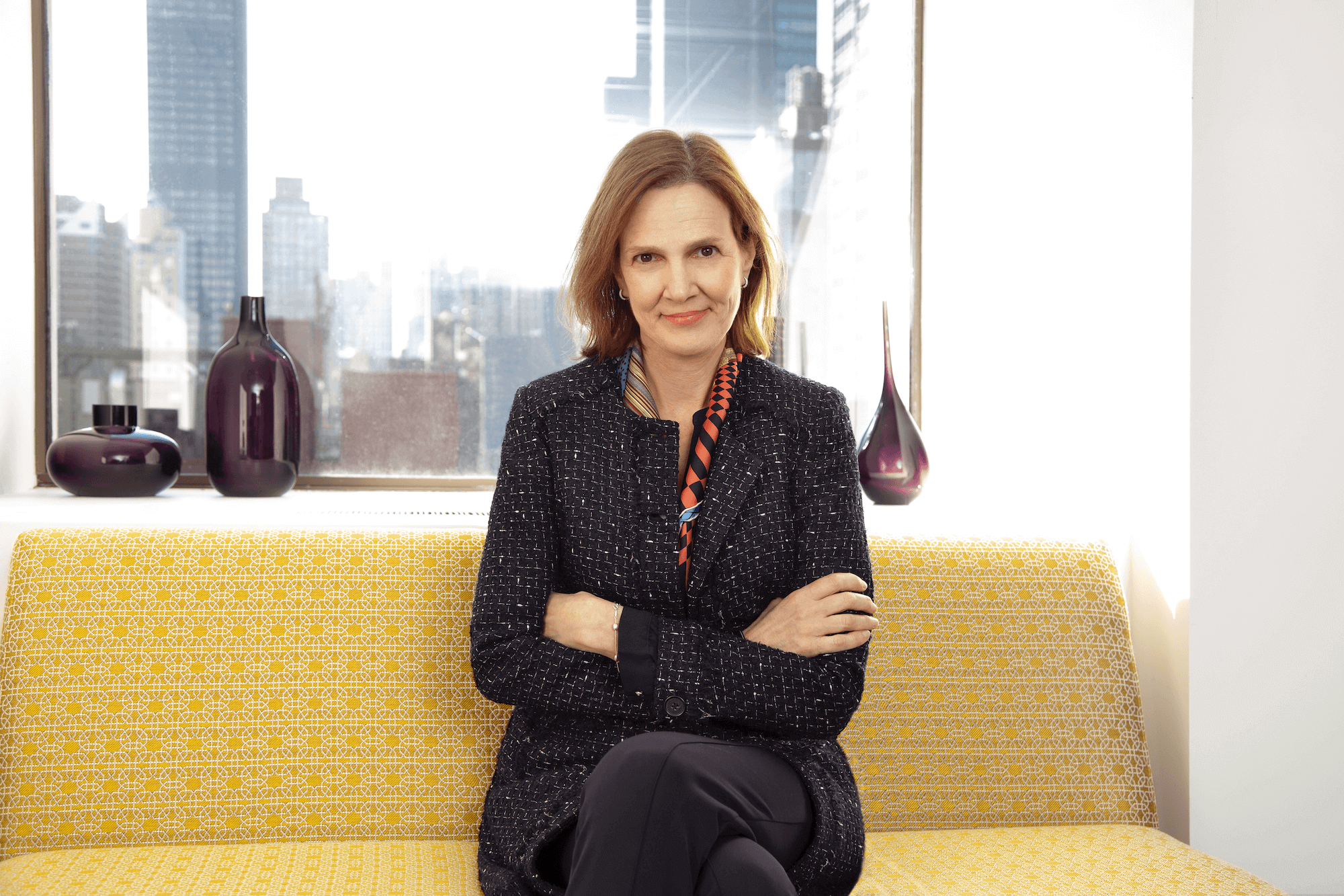 Headshot of Karen sitting on a sofa