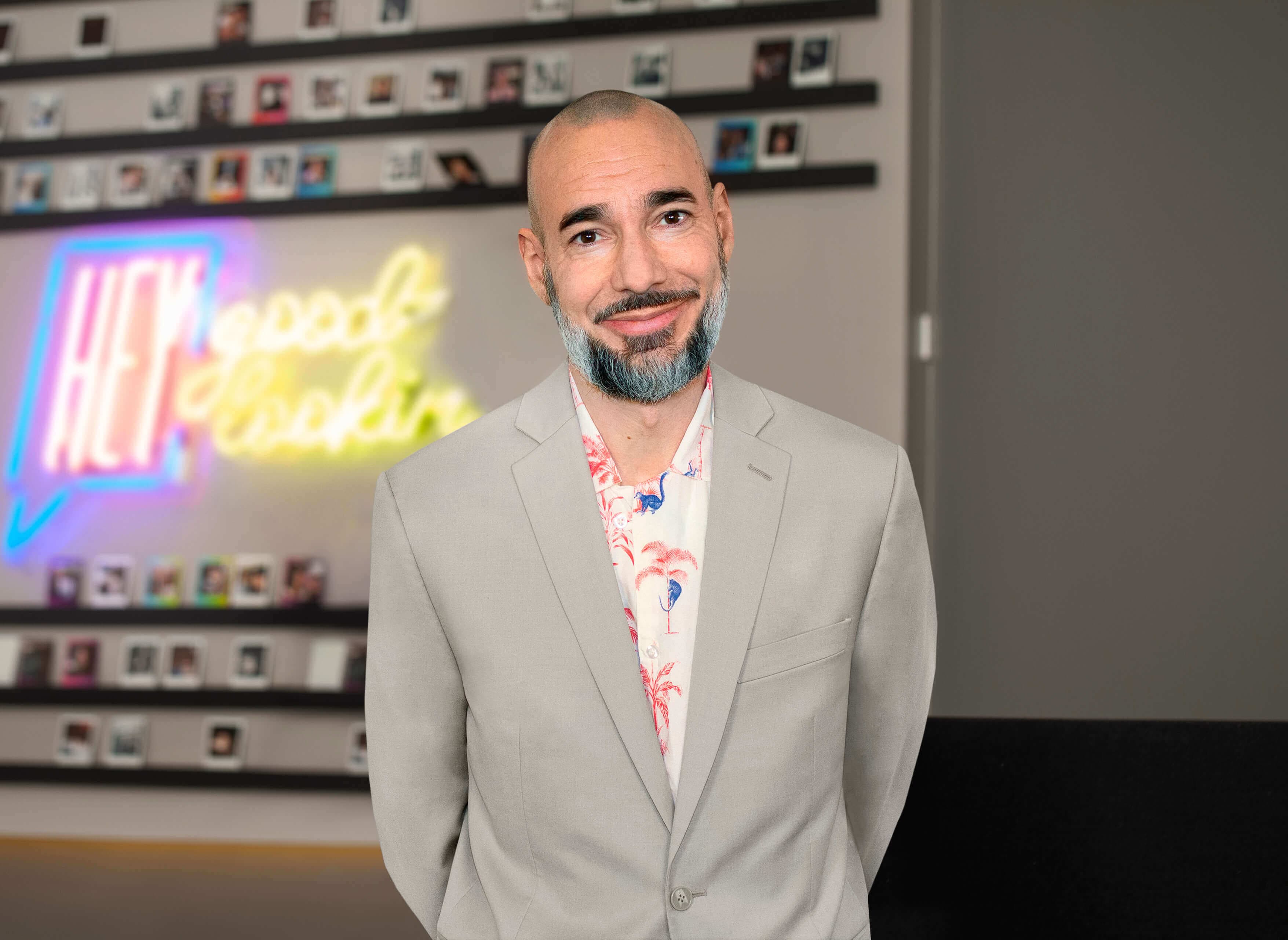 Headshot of Tom Beckman standing in a Weber Shandwick office